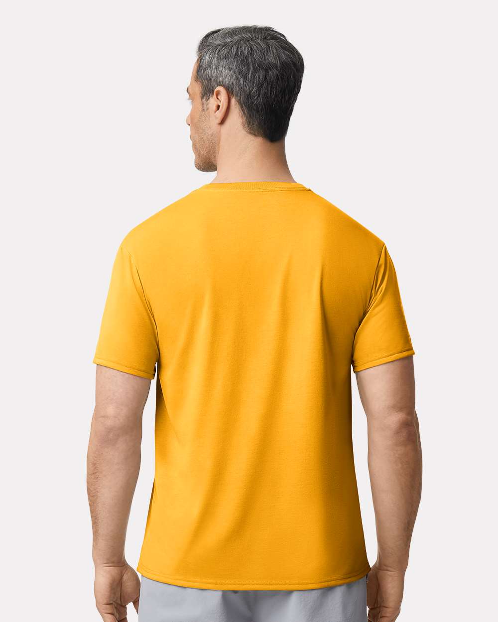 Unisex Performance® T-Shirt - OnModelBack - B09260123 - Gold