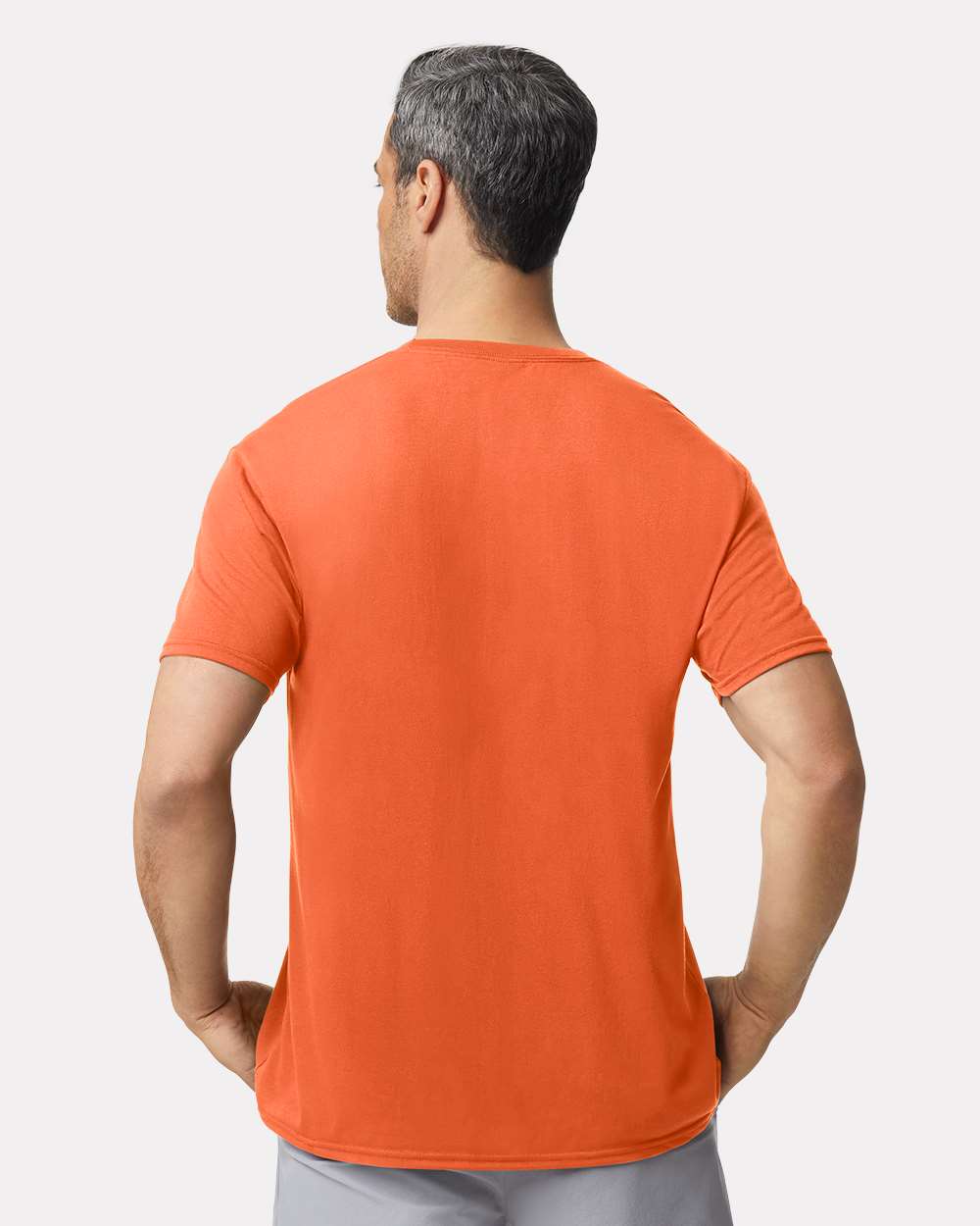 Unisex Performance® T-Shirt - OnModelBack - B09260663 - Orange